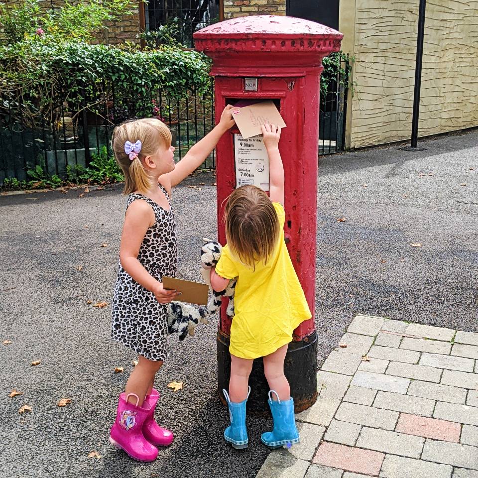 children posting a letter